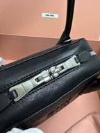 Black leather MiuMiu bag with silver-tone top clasp bar hardware