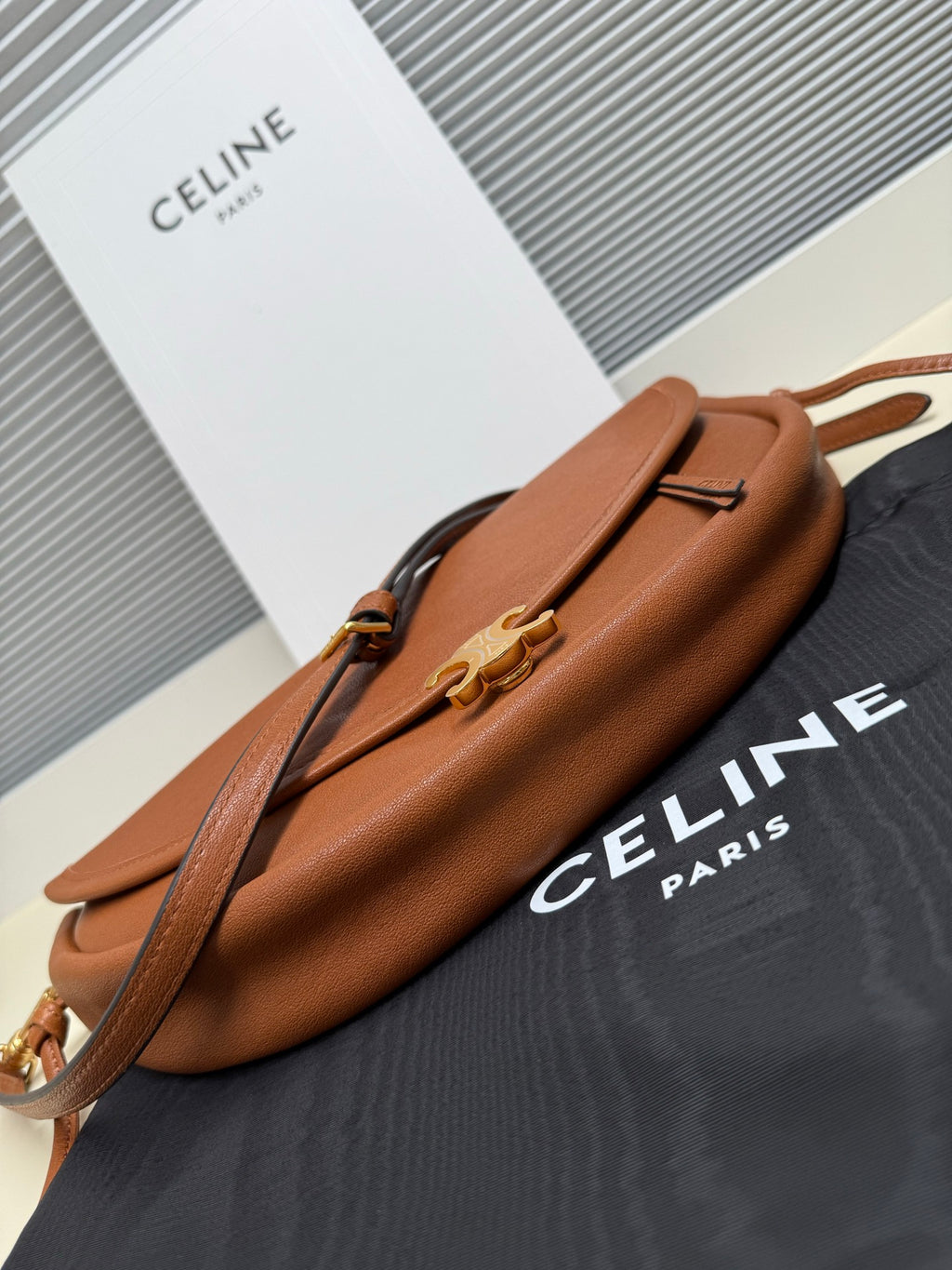 Celine brown leather crossbody bag with top handle and gold hardware