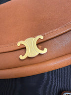 Celine gold C logo on brown leather flap