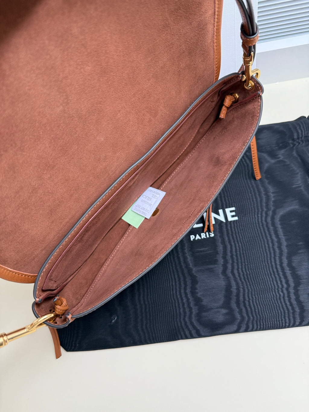 Celine brown leather crossbody bag with long strap and hanging tag