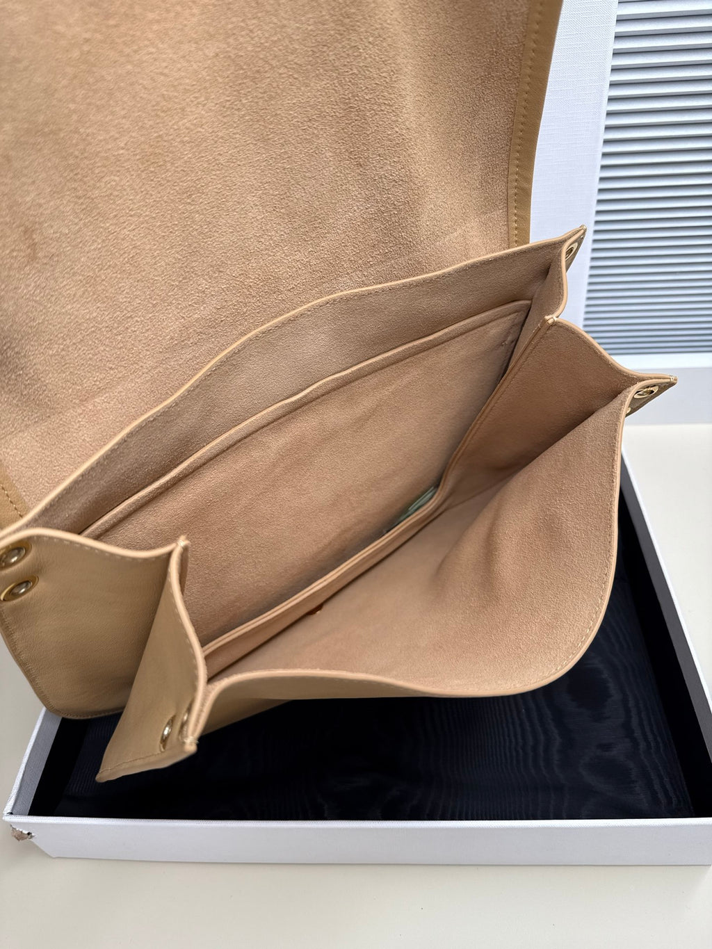 Celine beige leather crossbody bag open interior with inner stitched pocket