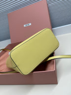 Lime green MiuMiu pouch with flap and strap, matching tote set
