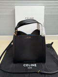 Celine structured handbag in dark leather with top handle, open front, gold-tone hardware
