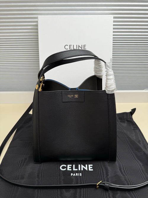 Celine structured handbag in dark leather with top handle, open front, gold-tone hardware