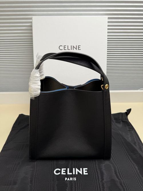 Celine handbag with top handle and blue interior, dark leather, gold-tone hardware detail