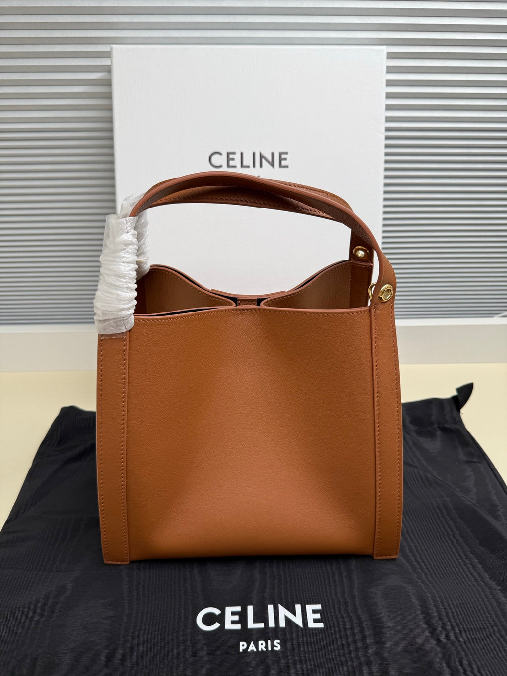 Celine tan leather mini handbag with open top and inner lining visible