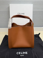Celine tan leather mini handbag with open top and inner lining visible