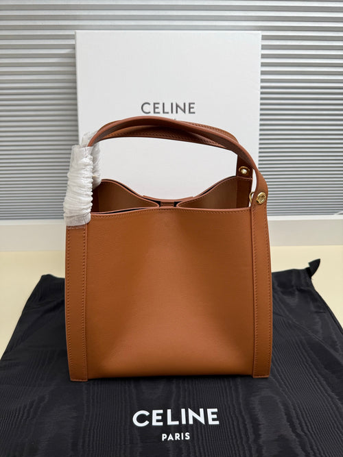 Celine tan leather mini handbag with open top and inner lining visible