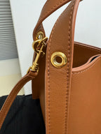 Celine tan leather mini handbag with gold zipper pull and side metal ring
