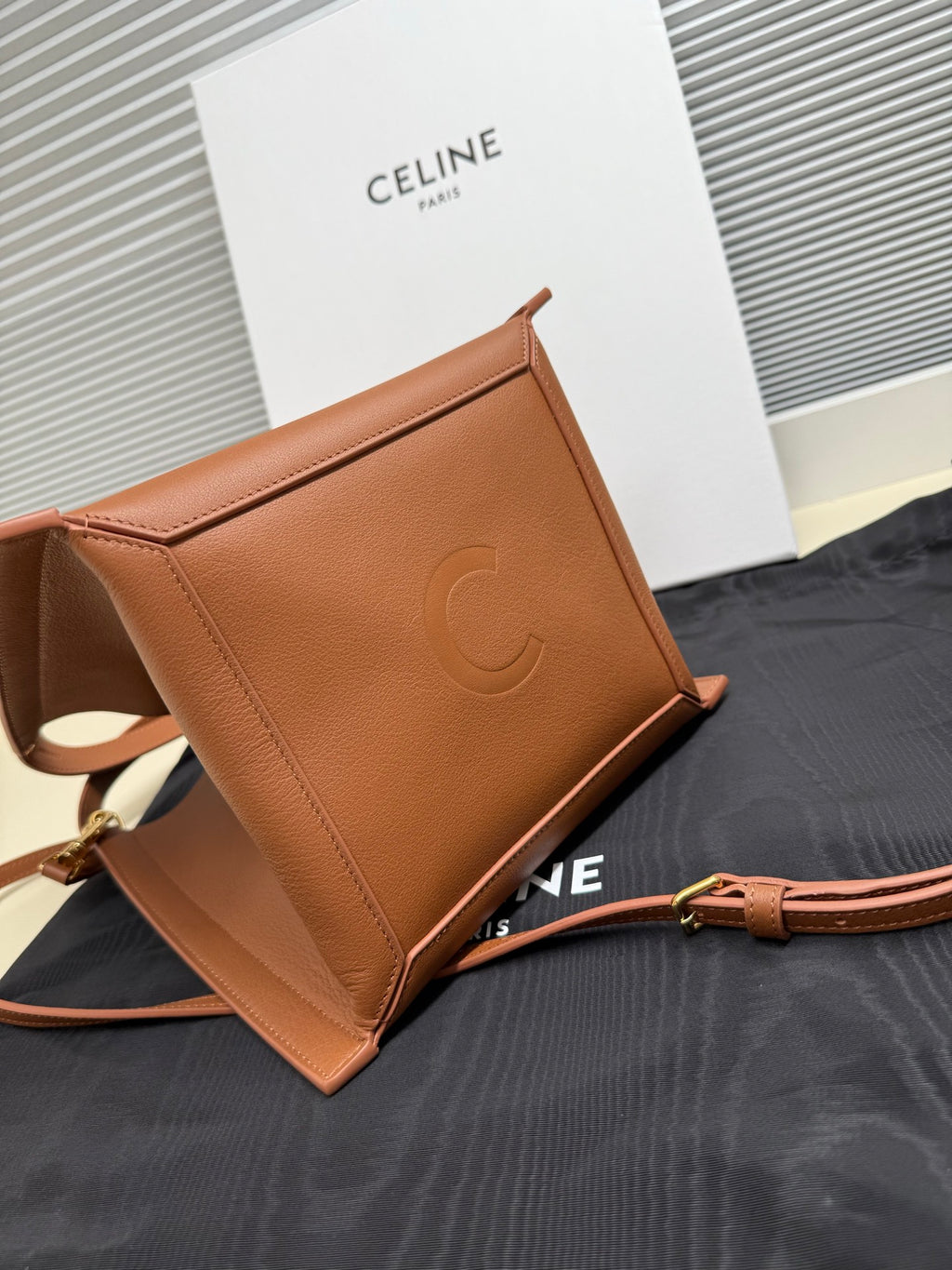Celine tan leather mini handbag with embossed C monogram on the front side