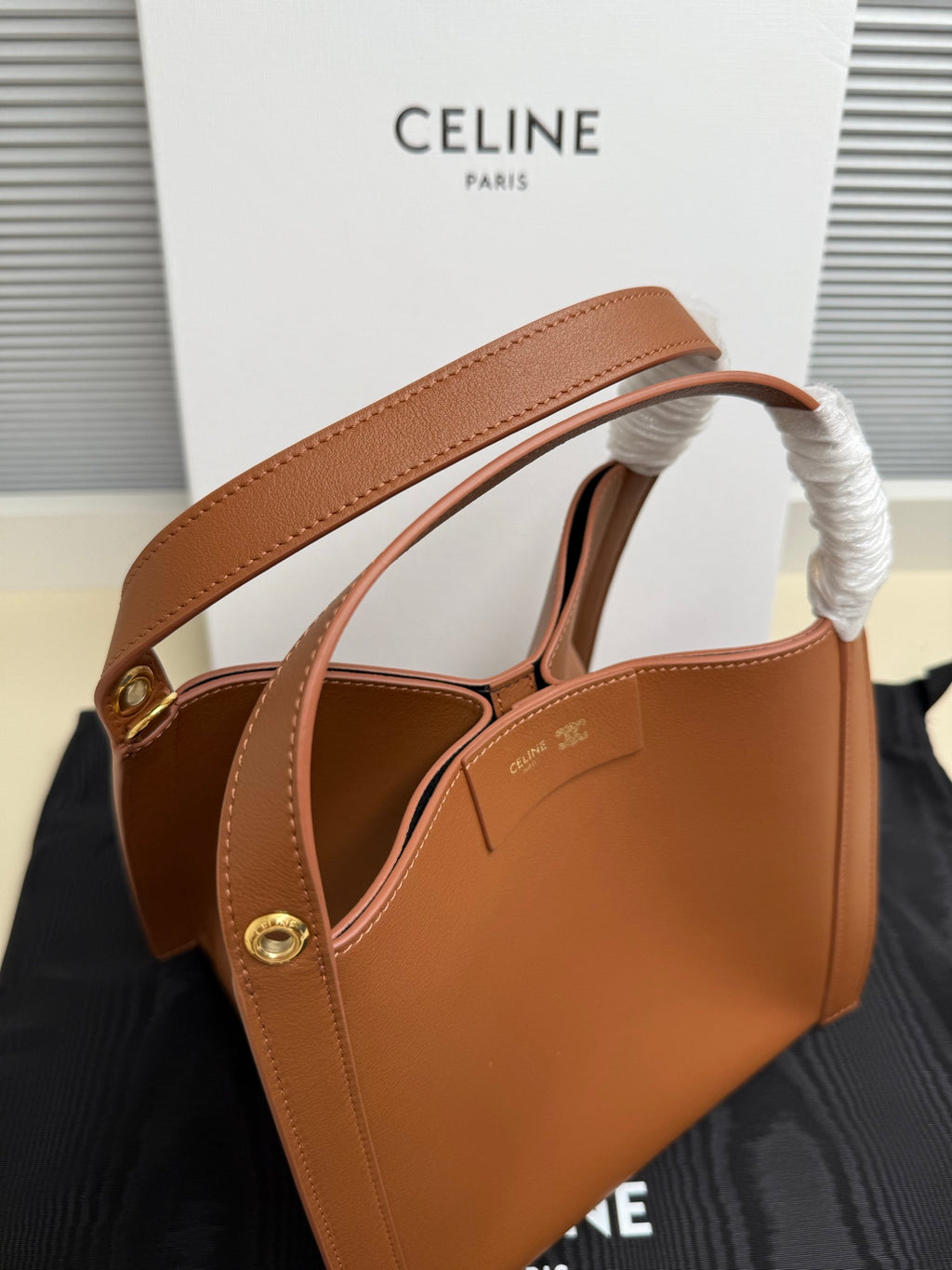 Celine tan leather mini handbag with top handle and braided handle cover