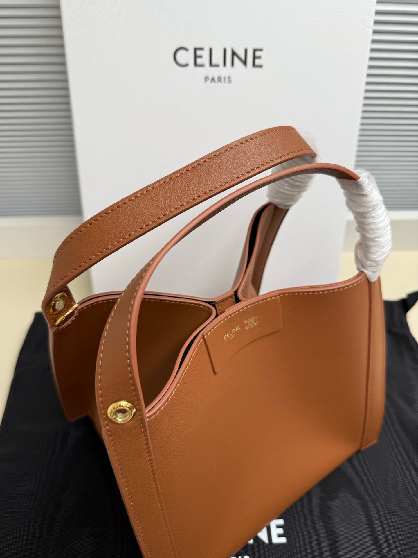 Celine tan leather mini handbag with top handle and braided handle cover