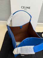 Celine blue leather tote bag showing brown interior lining