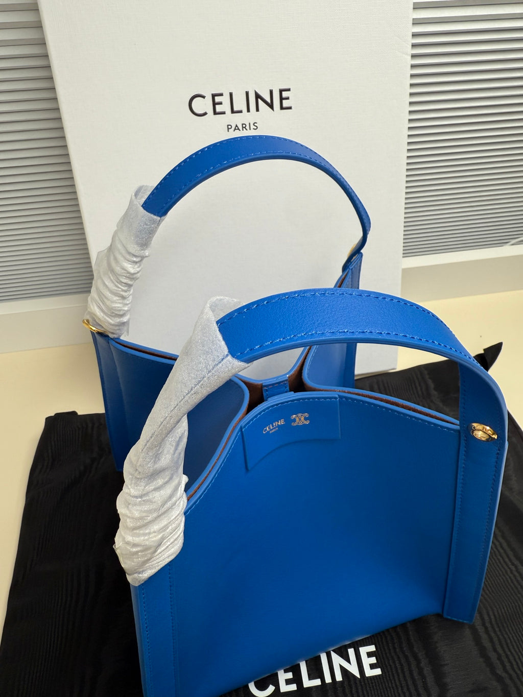 Celine blue leather tote bag with top handles and open interior view