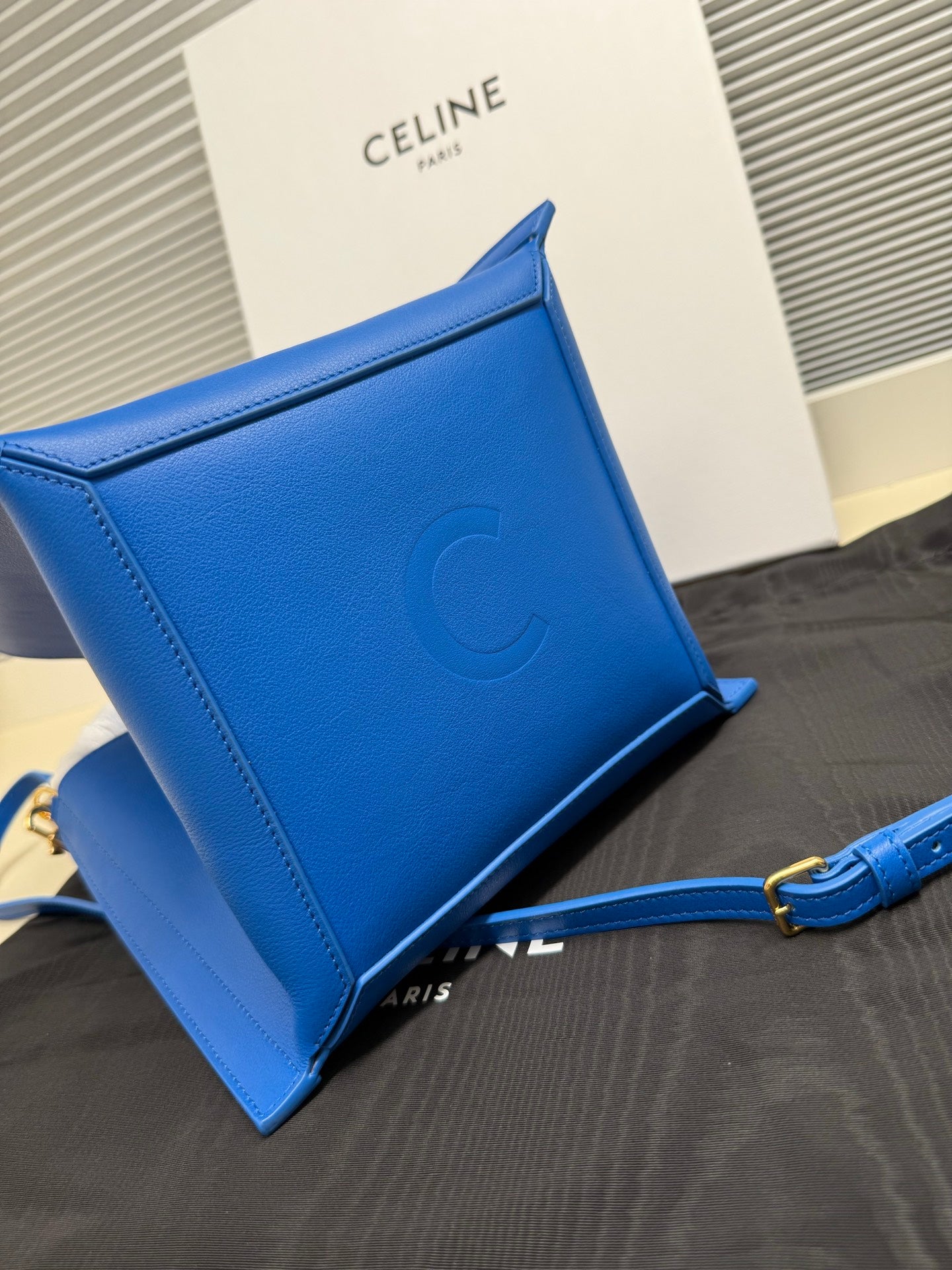 Celine blue leather pouch bag with embossed C logo and top edge