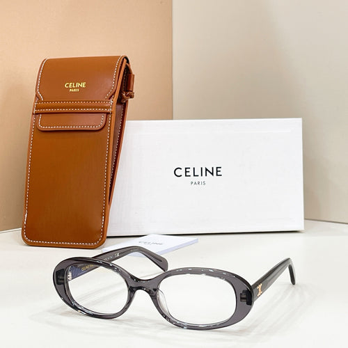 Celine eyeglasses with dark frames and clear lenses, shown beside a brown leather case