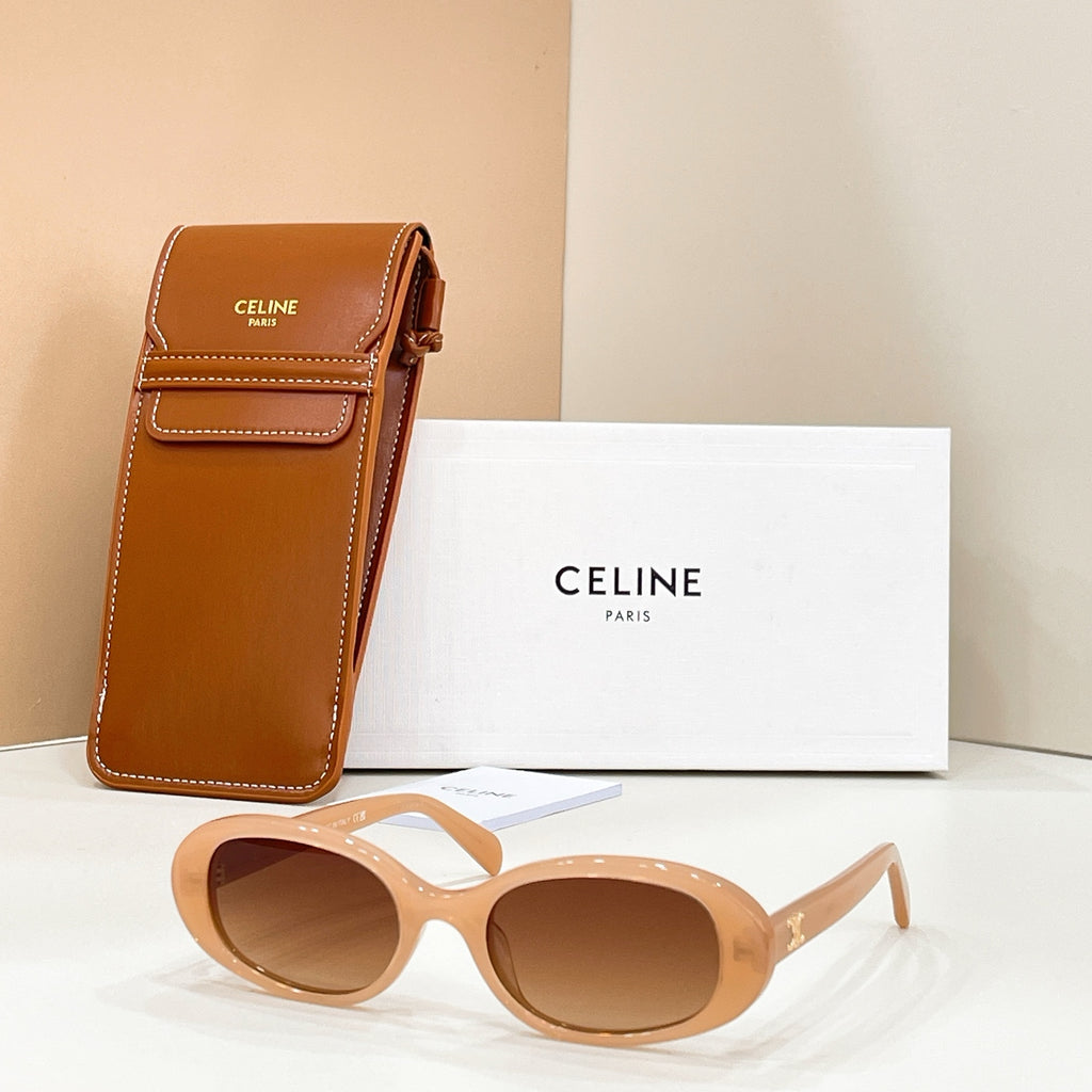 Celine sunglasses with light tan frames and tan tinted lenses, shown with brown leather case