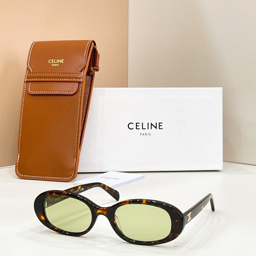 Celine sunglasses with tortoiseshell frames and pale green lenses, with brown leather case
