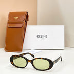 Celine sunglasses with tortoiseshell frames and pale green lenses, with brown leather case