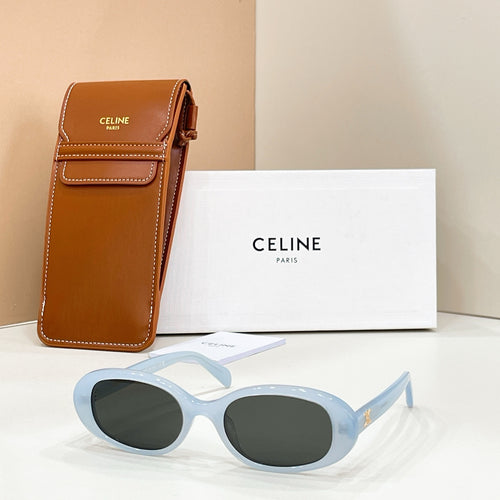 Celine sunglasses with light blue frames and dark tinted lenses