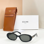 Celine sunglasses with black frames and dark tinted lenses