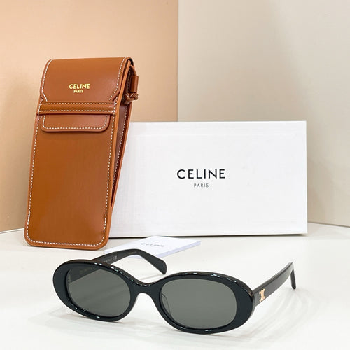 Celine sunglasses with black frames and dark tinted lenses