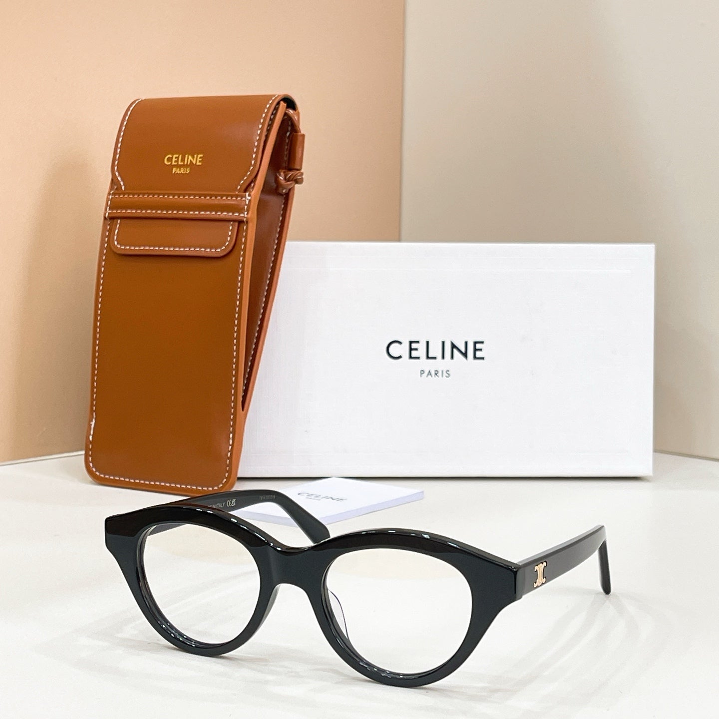 Celine glasses with black frames and brown-tinted lenses