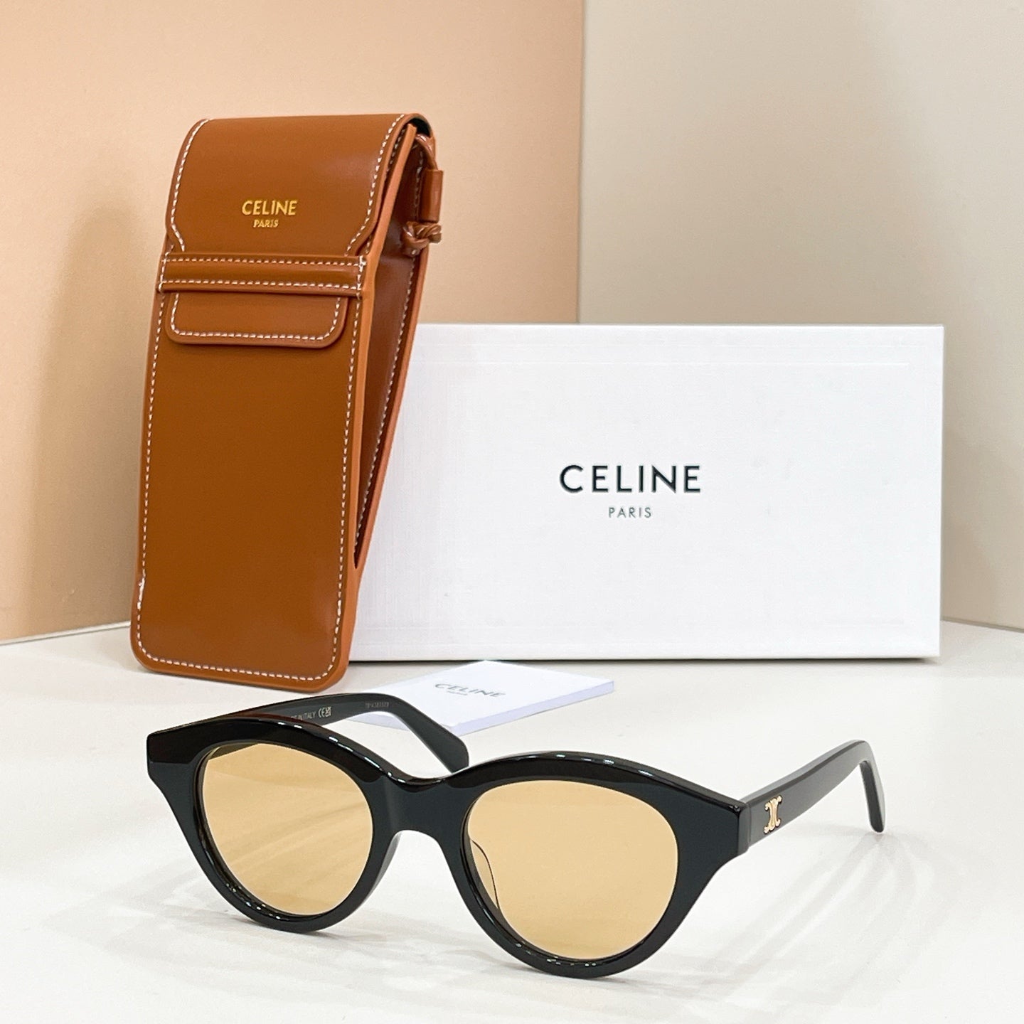 Celine glasses with black frames and amber lenses