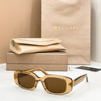 Bvlgari sunglasses with gold frame and dark brown lenses