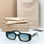 Bvlgari sunglasses with black frame and blue-tinted lenses