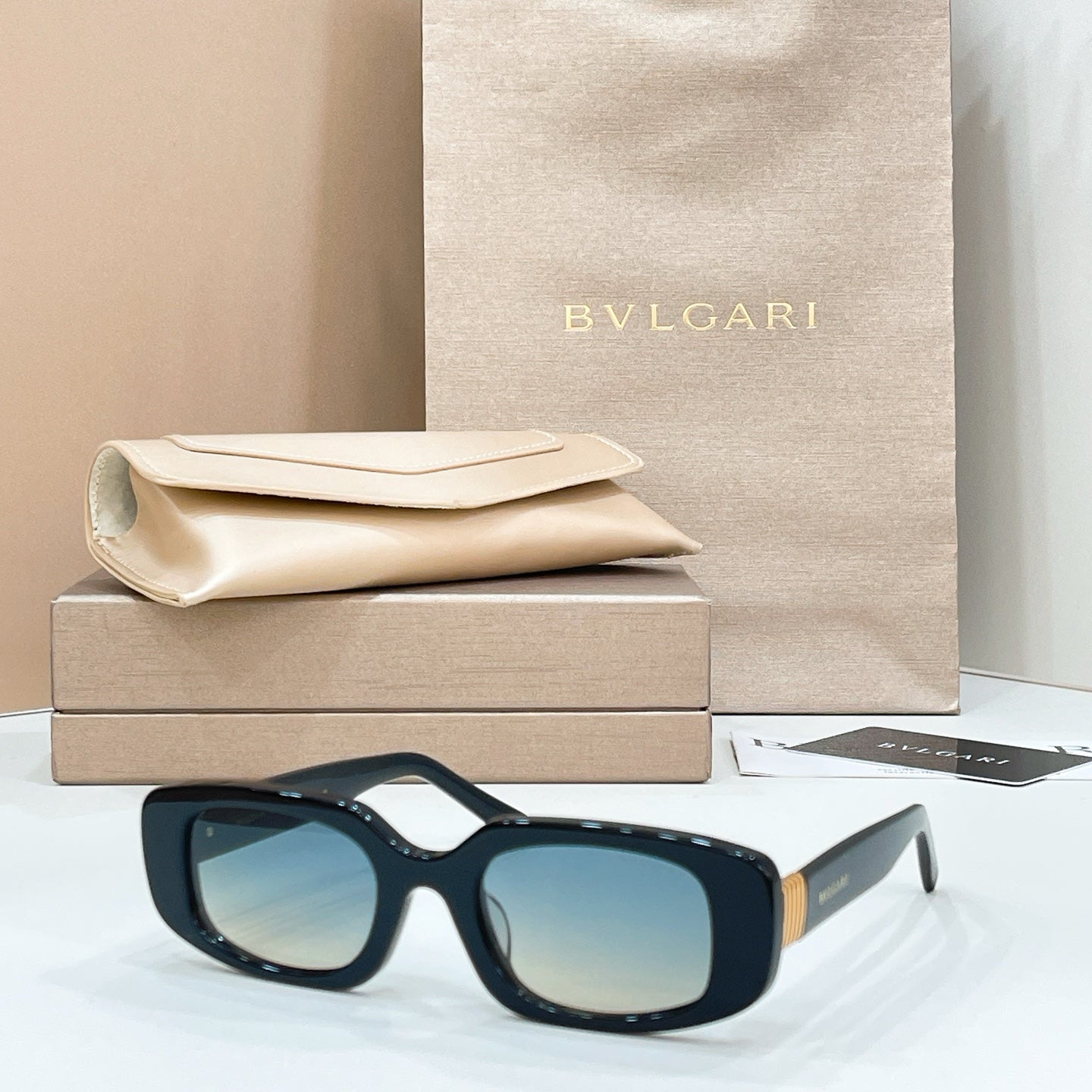 Bvlgari sunglasses with black frame and blue-tinted lenses