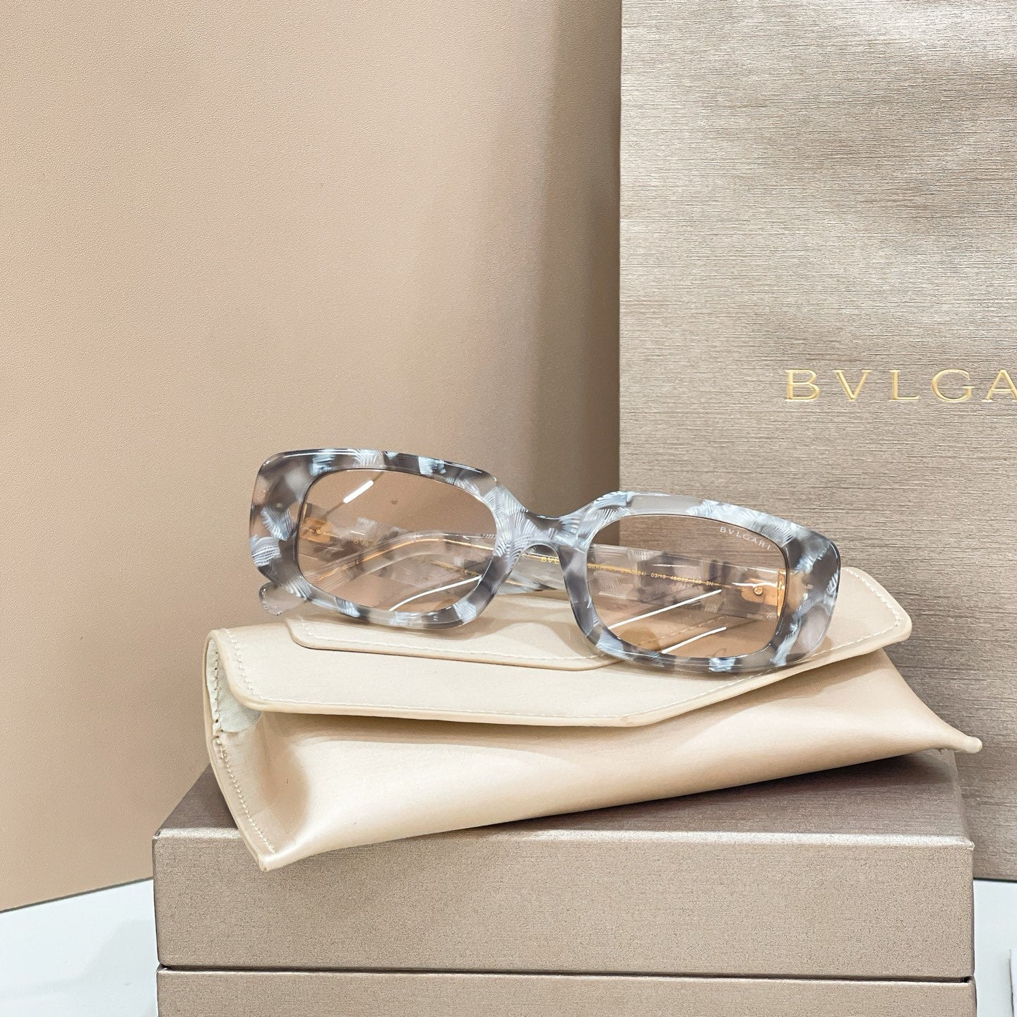 Bvlgari eyeglasses, clear gray marbled frames with gold-tone detail