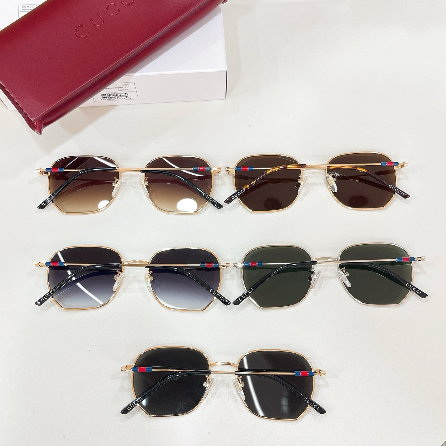 Sunglasses assortment: gold octagonal frames with dark tinted lenses