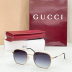 Sunglasses with gold octagonal frame and blue tinted lenses