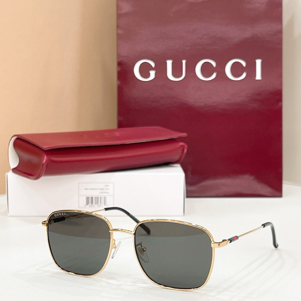 Gold-tone aviator sunglasses with dark green gradient lenses and double-bridge frame