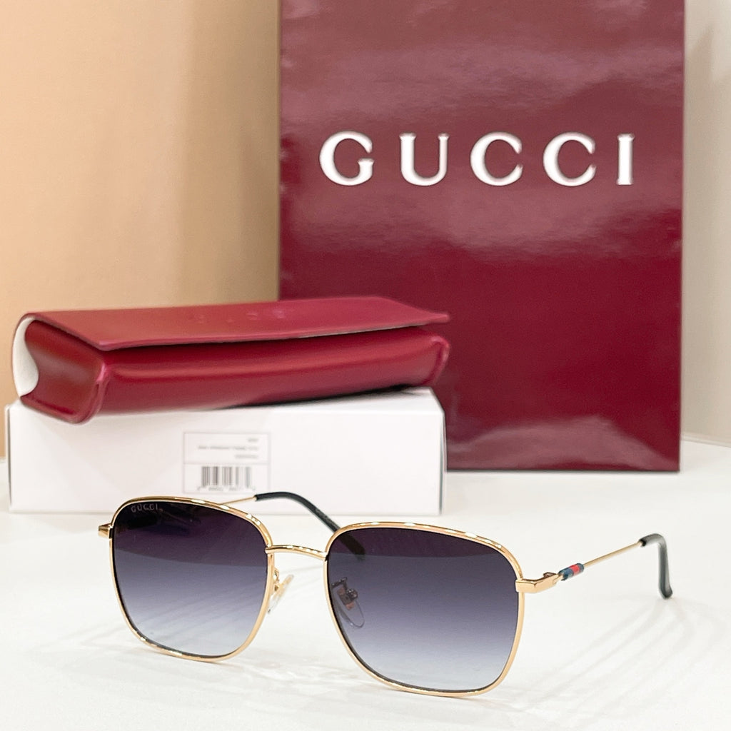 Gold-tone aviator sunglasses with dark purple gradient lenses and double-bridge frame