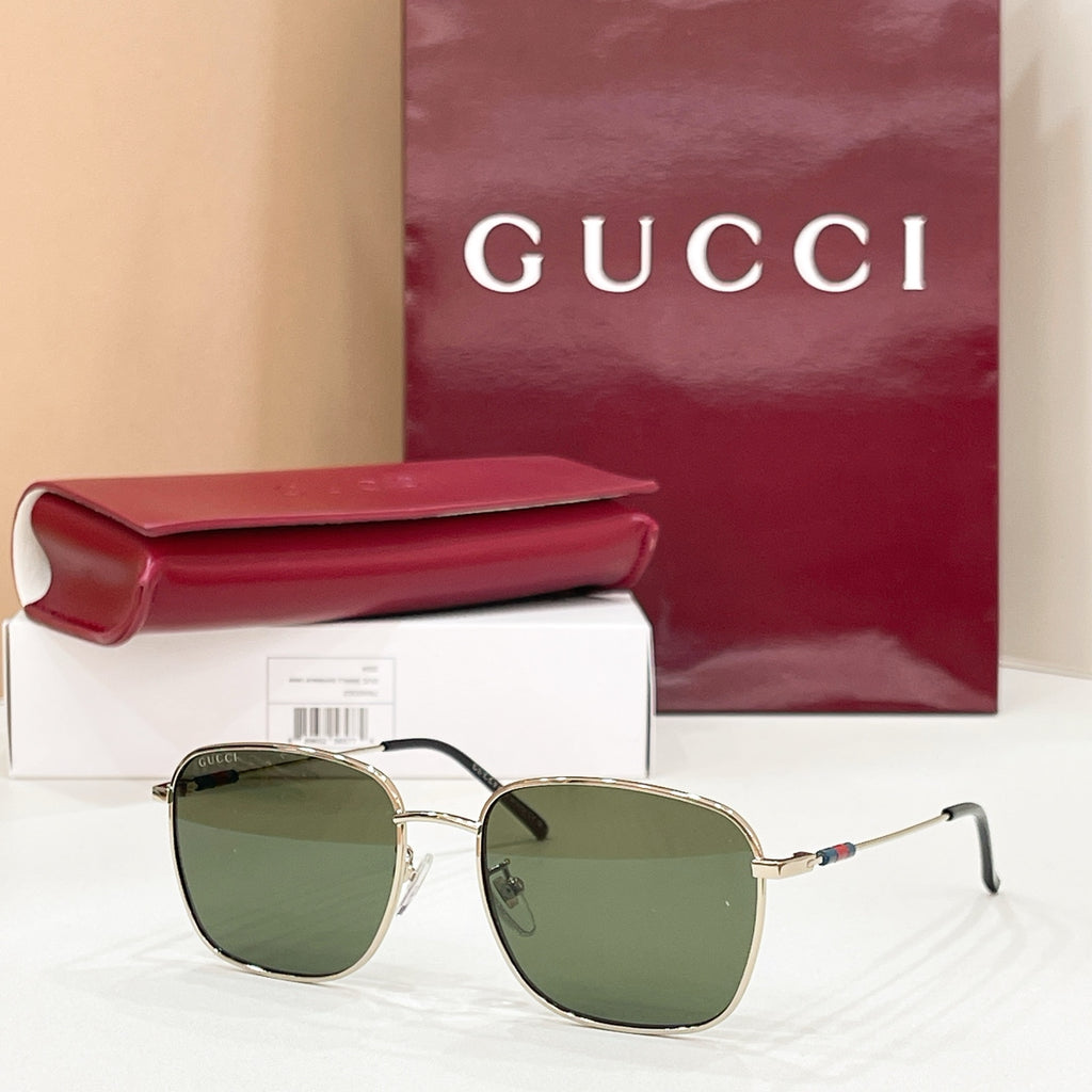 Gold-tone aviator sunglasses with dark green gradient lenses and double-bridge frame