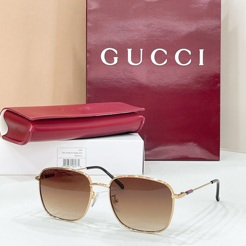 Gold-tone aviator sunglasses with dark brown gradient lenses and double-bridge frame