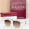 Gold-tone aviator sunglasses with dark brown gradient lenses and double-bridge frame