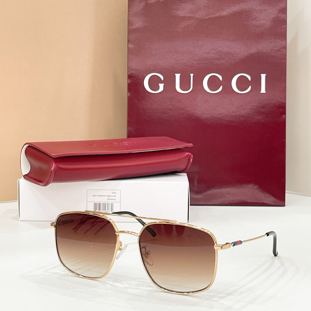 Gold-frame round sunglasses with amber lenses, slim arms and temple hinges