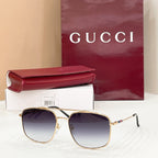 Gold-frame round sunglasses with purple-tinted lenses, slim arms and temple hinges