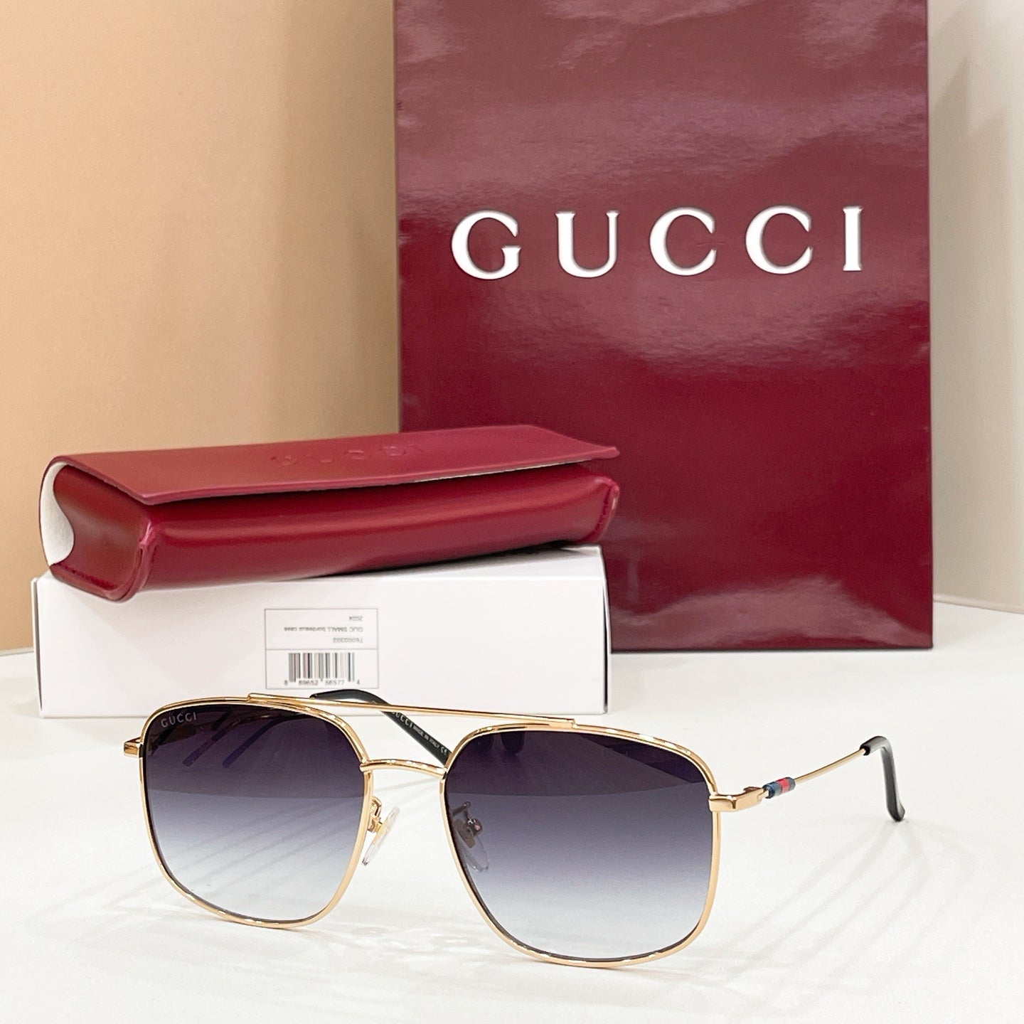 Gold-frame round sunglasses with purple-tinted lenses, slim arms and temple hinges