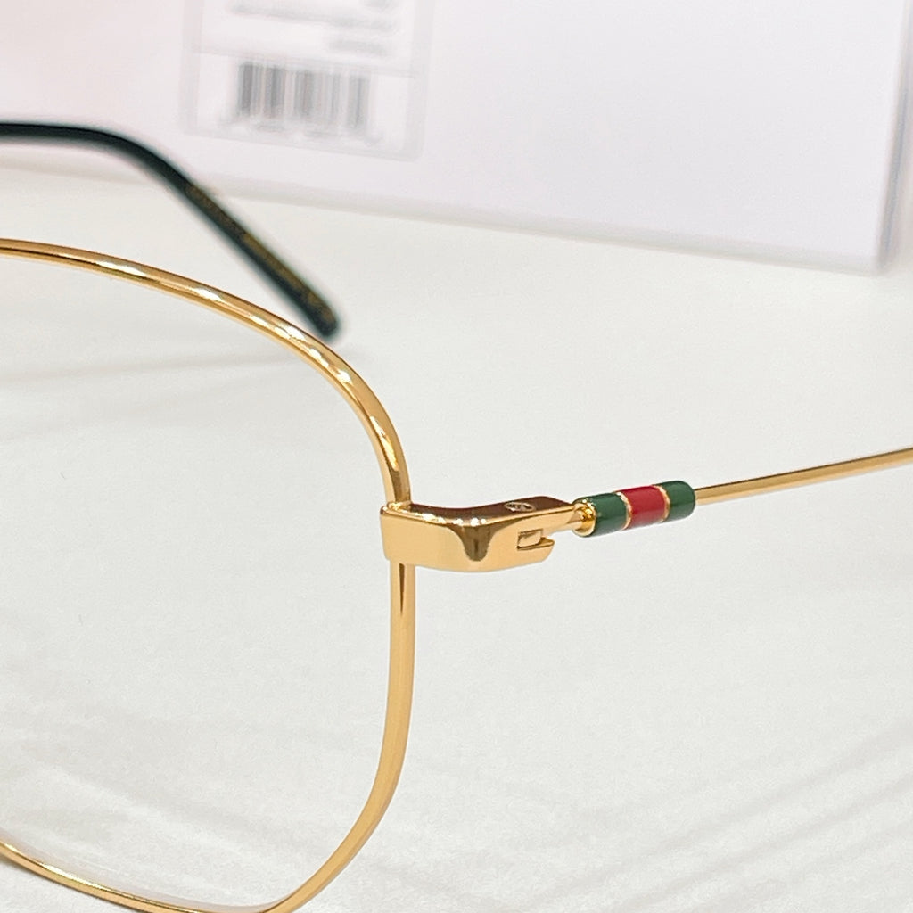 Gucci eyeglass arm with gold tone and multicolor web stripe detail