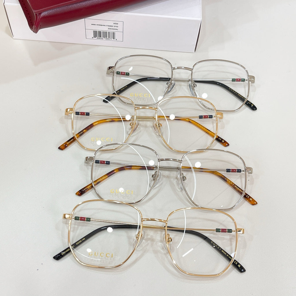 Gucci eyeglasses set with clear lenses, multiple gold and dark frames