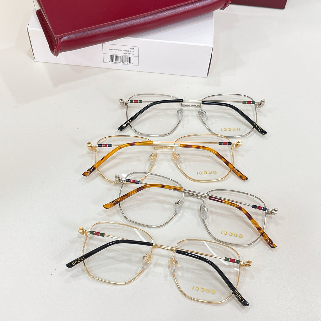 Gucci eyeglasses set with clear lenses, black and gold metal frames