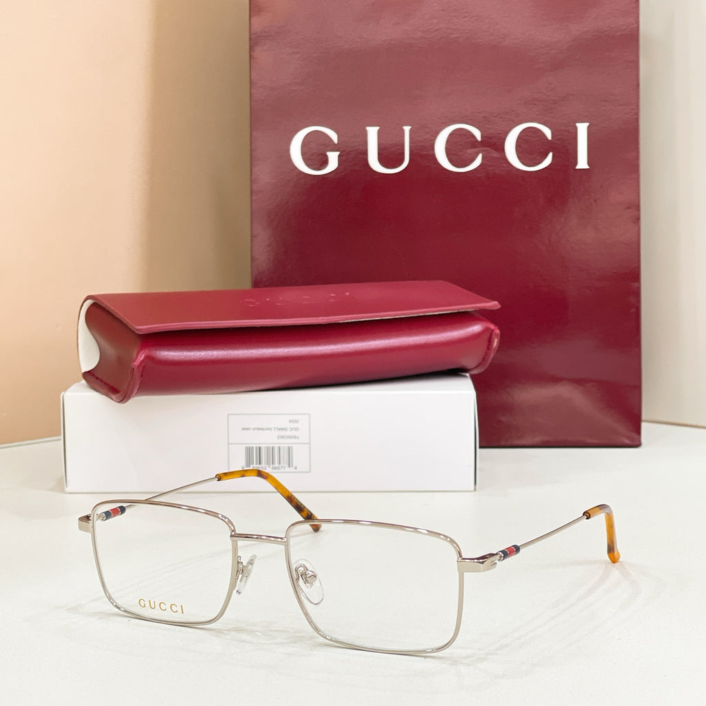 Gold metal eyeglasses with clear lenses and tortoise-pattern arms