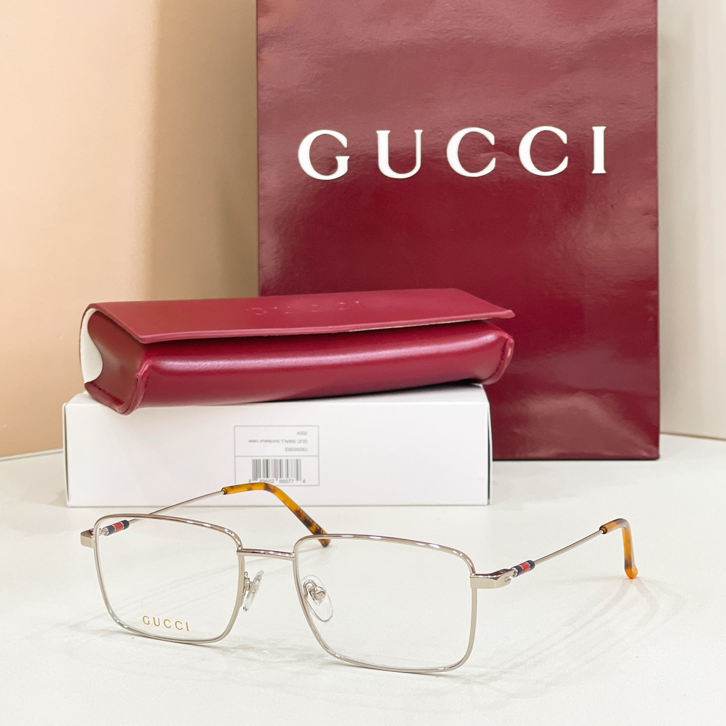 Gold metal eyeglasses with clear lenses and tortoise-pattern arms