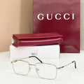 Gold metal eyeglasses with clear lenses and tortoise-pattern temples