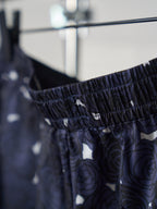 Navy skirt fabric detail with elastic waistband and small printed motifs