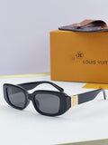Louis Vuitton glasses, black-and-white frames with dark lenses and gold bridge detail
